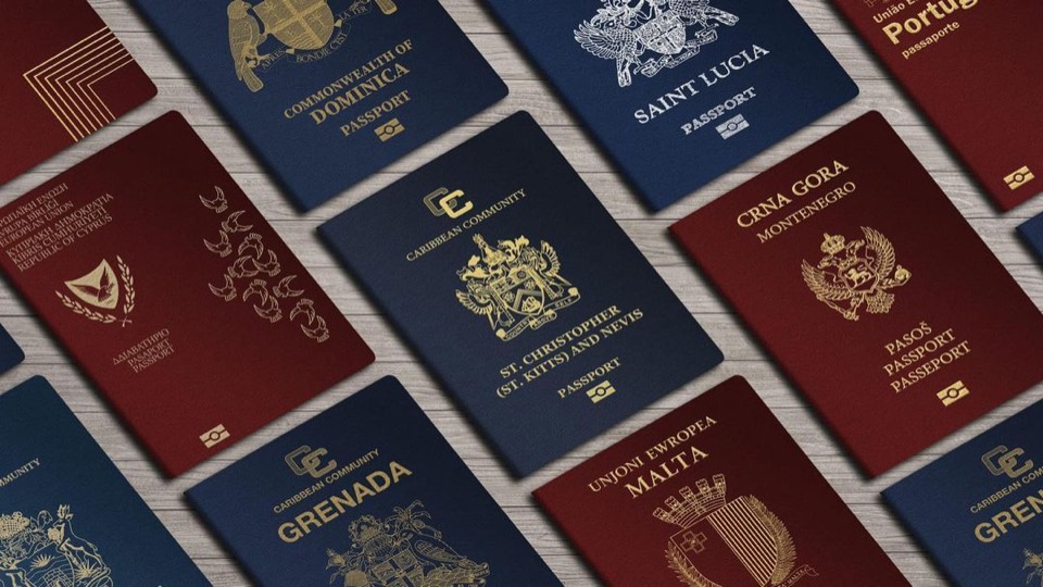 A collection of passports from different countries laid out on a table