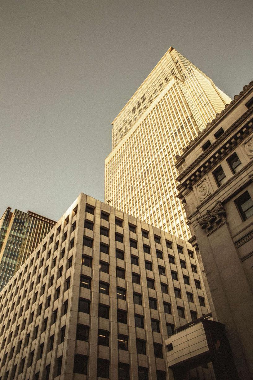 American office towers in golden evening light, seen from street level